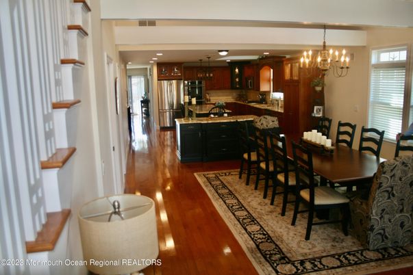 Chandelier, Dining room, Interior, Kitchen, Pendant Lights, Recessed Lighting, Stainless Steel Appliances, Wood Texture Flooring