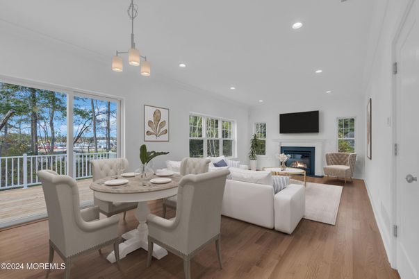 Dining room, Fireplace, Interior, Living room, Pendant Lights, Recessed Lighting, Wood Texture Flooring