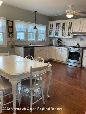 Dining room, Interior, Kitchen, Pendant Lights, Stainless Steel Appliances, Wood Texture Flooring