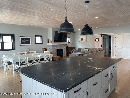 Dining room, Fireplace, Interior, Kitchen, Pendant Lights, Recessed Lighting, Wooden Ceilings, Wood Texture Flooring