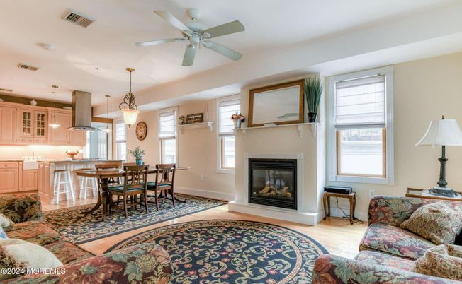 Dining room, Fireplace, Interior, Kitchen, Pendant Lights, Wood Texture Flooring