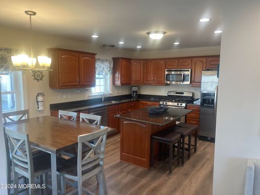 Dining room, Interior, Kitchen, Pendant Lights, Recessed Lighting, Stainless Steel Appliances, Wood Texture Flooring