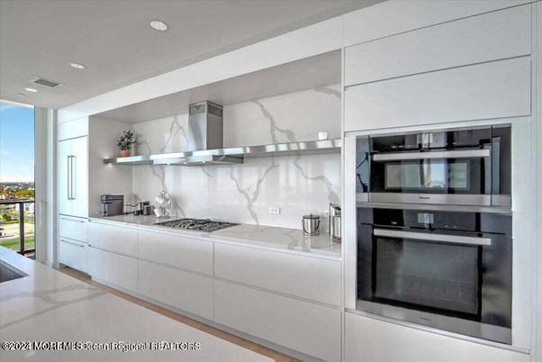 Interior, Kitchen, Marble Walls, Recessed Lighting, Stainless Steel Appliances