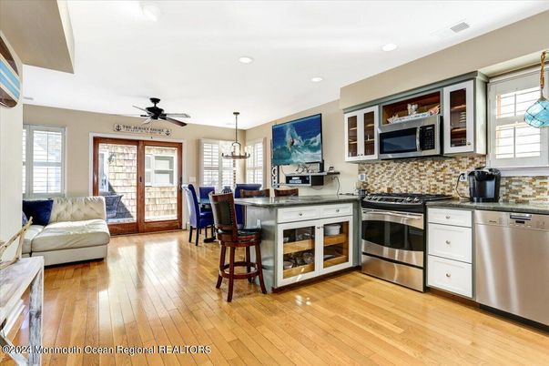 Dining room, Interior, Kitchen, Pendant Lights, Recessed Lighting, Stainless Steel Appliances, Wood Texture Flooring