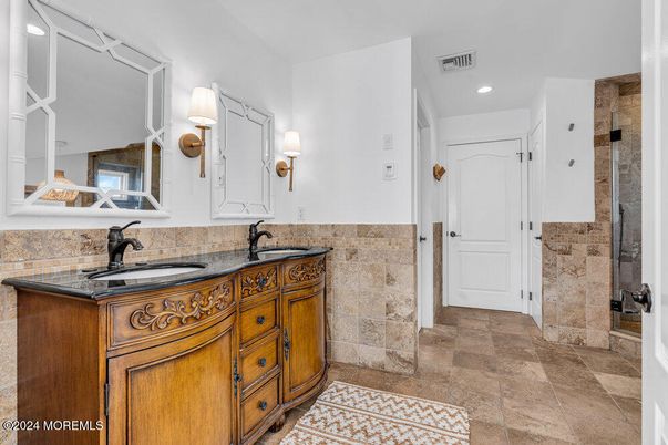 Bathroom, Dual Sink Vanities, Interior, Recessed Lighting, Stone Walls