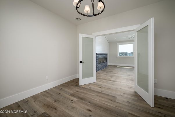 Chandelier, Empty room, Interior, Recessed Lighting, Wood Texture Flooring
