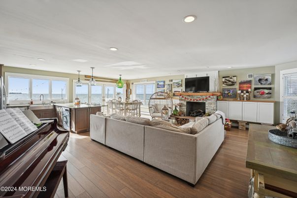 Dining room, Fireplace, Interior, Kitchen, Living room, Pendant Lights, Piano, Recessed Lighting, Wood Texture Flooring