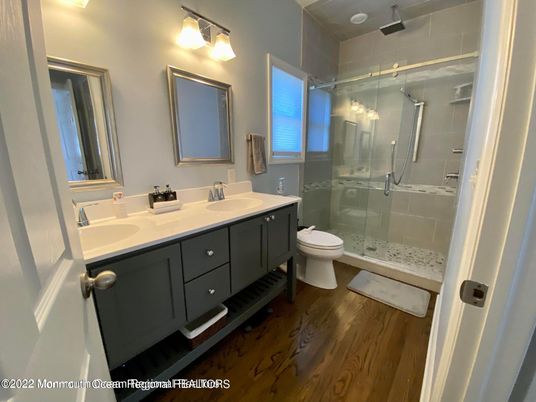 Bathroom, Dual Sink Vanities, Glass Shower, Interior, Wood Texture Flooring