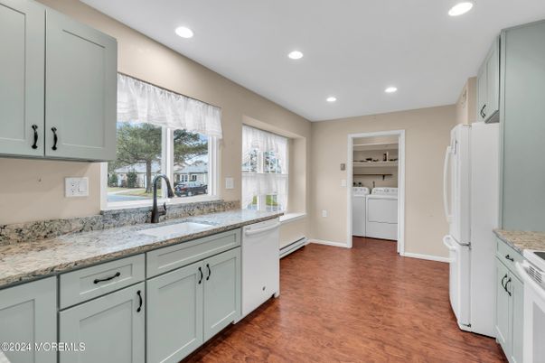 Interior, Kitchen, Recessed Lighting, Washer, Wood Texture Flooring