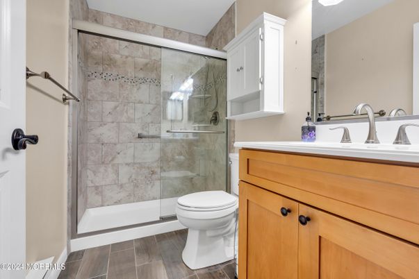 Bathroom, Glass Shower, Interior, Marble Walls, Wood Texture Flooring