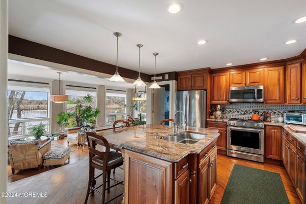 Dining room, Interior, Kitchen, Pendant Lights, Recessed Lighting, Stainless Steel Appliances, Wood Texture Flooring