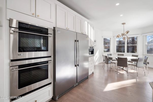 Dining room, Interior, Kitchen, Pendant Lights, Recessed Lighting, Stainless Steel Appliances, Wood Texture Flooring