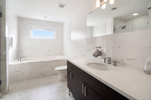 Bathroom, Dual Sink Vanities, Interior, Marble, Marble Walls, Recessed Lighting