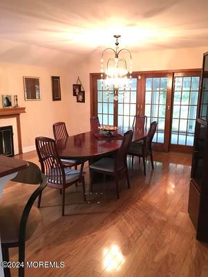 Chandelier, Dining room, Fireplace, Interior, Wood Texture Flooring