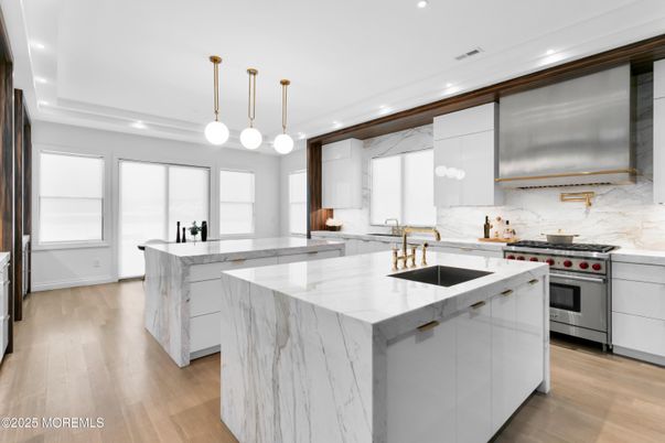 Interior, Kitchen, Marble Walls, Pendant Lights, Recessed Lighting, Stainless Steel Appliances, Wood Texture Flooring