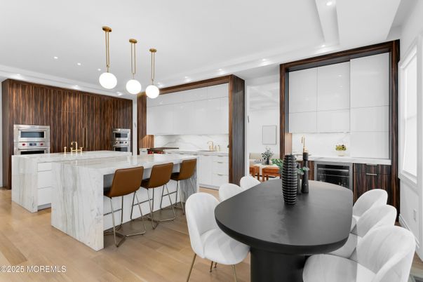 Dining room, Interior, Kitchen, Marble Walls, Pendant Lights, Recessed Lighting, Stainless Steel Appliances, Wood Texture Flooring