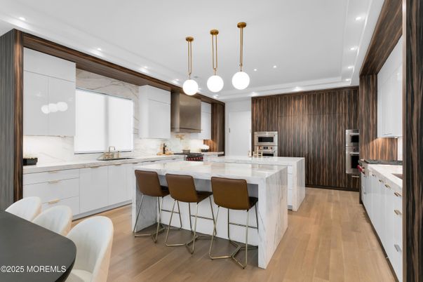 Interior, Kitchen, Marble Walls, Pendant Lights, Recessed Lighting, Stainless Steel Appliances, Wood Texture Flooring