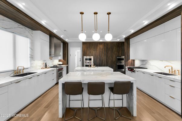 Interior, Kitchen, Marble Walls, Pendant Lights, Recessed Lighting, Stainless Steel Appliances, Wood Texture Flooring