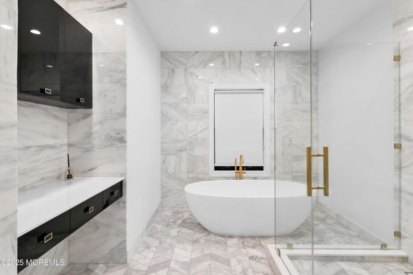 Bathroom, Free Standing Baths, Glass Shower, Interior, Marble, Marble Walls, Recessed Lighting