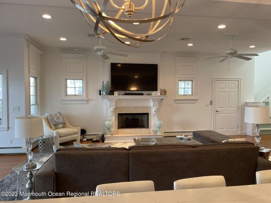 Chandelier, Fireplace, Interior, Living room, Recessed Lighting, Wood Texture Flooring
