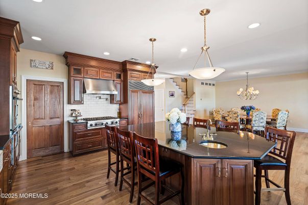 Chandelier, Dining room, Interior, Kitchen, Pendant Lights, Recessed Lighting, Stainless Steel Appliances, Wood Texture Flooring