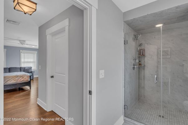 Bathroom, Bedroom, Glass Shower, Interior, Marble Walls, Recessed Lighting, Wood Texture Flooring