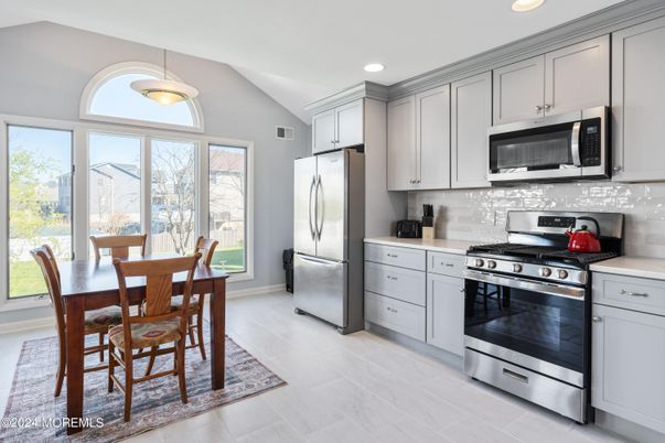 Dining room, Interior, Kitchen, Pendant Lights, Recessed Lighting, Stainless Steel Appliances, Wood Texture Flooring