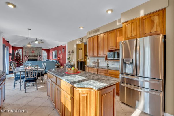 Dining room, Fireplace, Interior, Kitchen, Pendant Lights, Recessed Lighting, Stainless Steel Appliances, Stone Walls