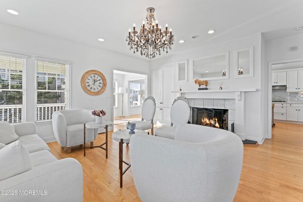 Chandelier, Fireplace, Interior, Living room, Recessed Lighting, Wood Texture Flooring