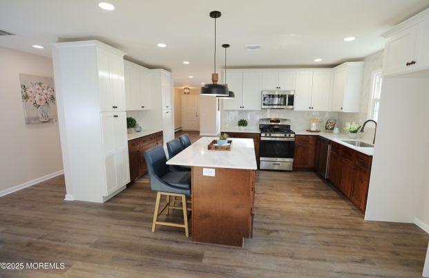 Dining room, Interior, Kitchen, Pendant Lights, Recessed Lighting, Stainless Steel Appliances, Wood Texture Flooring