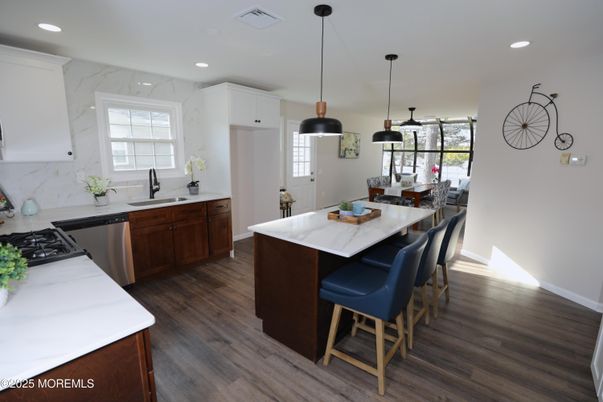 Dining room, Interior, Kitchen, Marble Walls, Pendant Lights, Recessed Lighting, Stainless Steel Appliances, Wood Texture Flooring