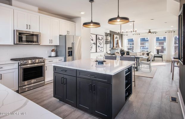 Dining room, Interior, Kitchen, Living room, Pendant Lights, Recessed Lighting, Stainless Steel Appliances, Wood Texture Flooring