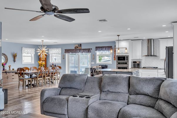 Dining room, Interior, Kitchen, Living room, Pendant Lights, Recessed Lighting, Stainless Steel Appliances, Wood Texture Flooring