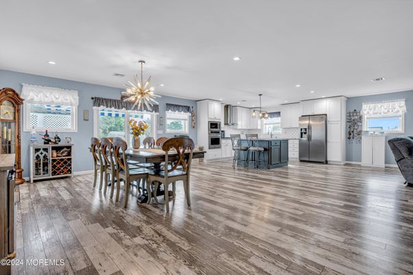 Dining room, Interior, Kitchen, Pendant Lights, Recessed Lighting, Stainless Steel Appliances, Wood Texture Flooring