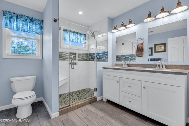 Bathroom, Dual Sink Vanities, Glass Shower, Interior, Recessed Lighting, Wood Texture Flooring