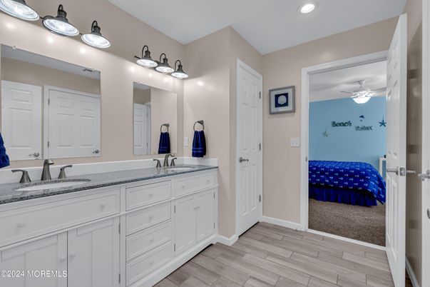 Bathroom, Bedroom, Dual Sink Vanities, Interior, Recessed Lighting, Wood Texture Flooring