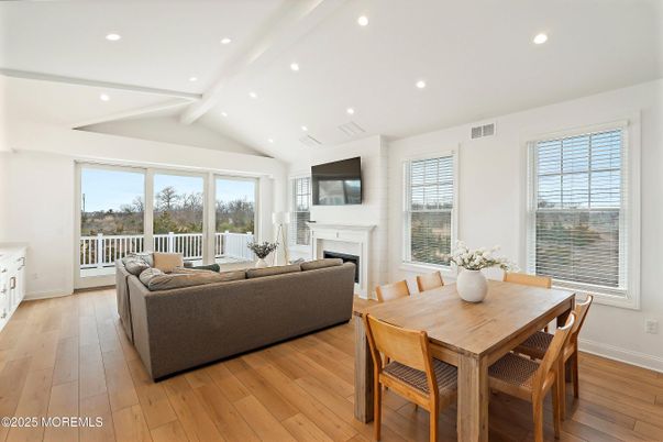 Dining room, Fireplace, Interior, Living room, Recessed Lighting, Wood Texture Flooring