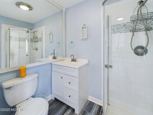 Bathroom, Dual Sink Vanities, Glass Shower, Interior, Recessed Lighting, Wood Texture Flooring
