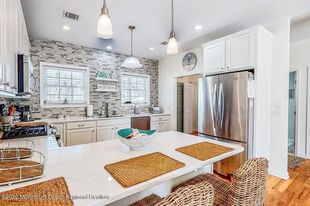 Interior, Kitchen, Pendant Lights, Recessed Lighting, Stainless Steel Appliances, Stone Walls, Wood Texture Flooring