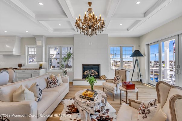 Chandelier, Fireplace, Interior, Living room, Recessed Lighting, Wood Texture Flooring
