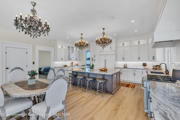 Chandelier, Dining room, Interior, Kitchen, Recessed Lighting, Stainless Steel Appliances, Wood Texture Flooring