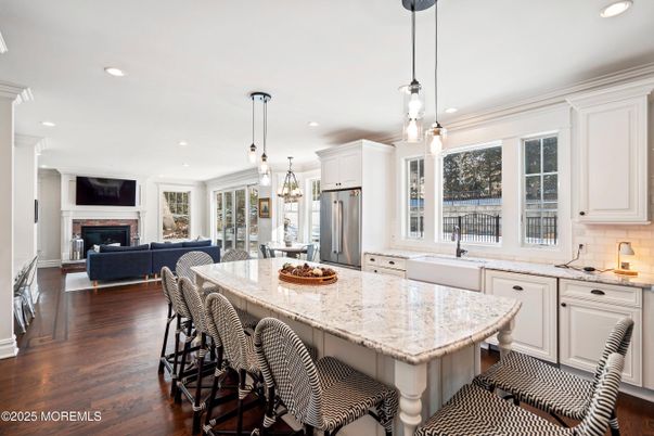 Fireplace, Interior, Kitchen, Living room, Pendant Lights, Recessed Lighting, Stainless Steel Appliances, Wood Texture Flooring
