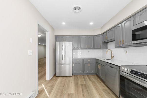 Interior, Kitchen, Recessed Lighting, Stainless Steel Appliances, Wood Texture Flooring