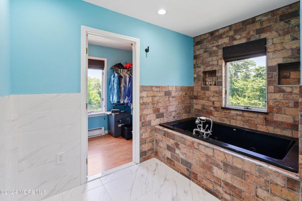 Bathroom, Dual Sink Vanities, Interior, Marble, Recessed Lighting, Stone Walls