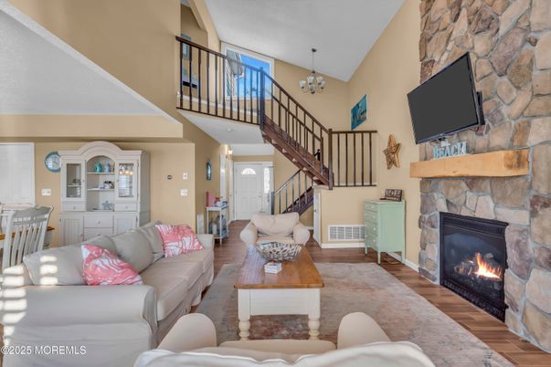 Chandelier, Fireplace, Interior, Living room, Stone Walls, Wood Texture Flooring