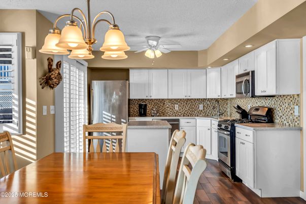 Dining room, Interior, Kitchen, Recessed Lighting, Stainless Steel Appliances, Wood Texture Flooring