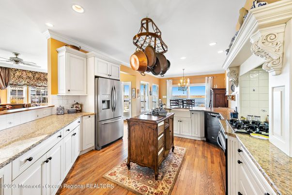 Chandelier, Dining room, Interior, Kitchen, Recessed Lighting, Stainless Steel Appliances, Wood Texture Flooring