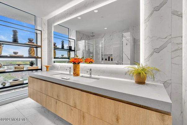 Bathroom, Dual Sink Vanities, Glass Shower, Interior, Marble, Marble Walls, Recessed Lighting