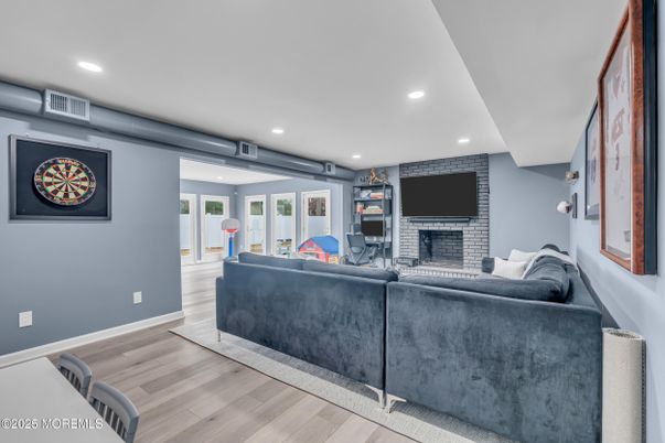 Fireplace, Interior, Living room, Recessed Lighting, Stone Walls, Wood Texture Flooring