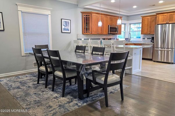 Dining room, Interior, Kitchen, Pendant Lights, Recessed Lighting, Stainless Steel Appliances, Wood Texture Flooring
